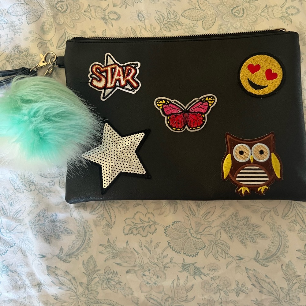 Black wrist bag with patches
